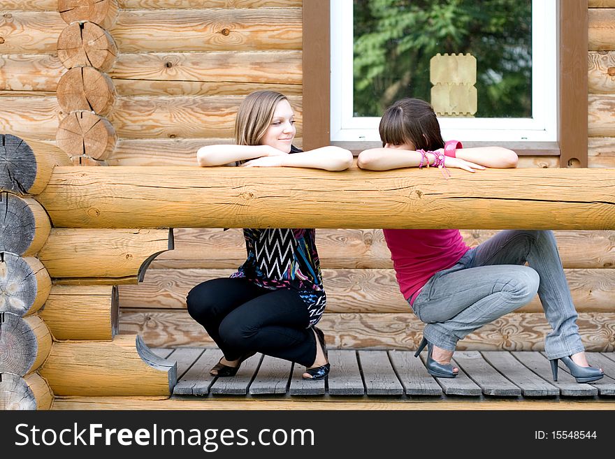 Two female friends on a veranda