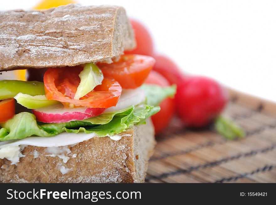 Closeup diet brown baguette with vegetable on white background