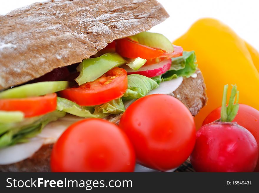 Closeup diet brown baguette with vegetable on white background