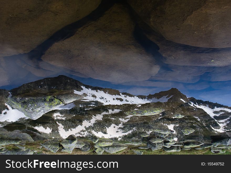 Mountain reflecting in pond in the Pirin range - Bulgarian balkans