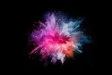 Abstract Colored Dust Explosion On A Black Background. Stock Images