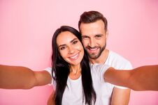 Photo Of Nice Couple With Man Hugging His Beloved Girlfriend From Back While Isolated With Pastel Background Stock Images Photo Of Nice Couple With Man Hugging His Beloved Girlfriend From Back While Isolated With Pastel Background Stock Images