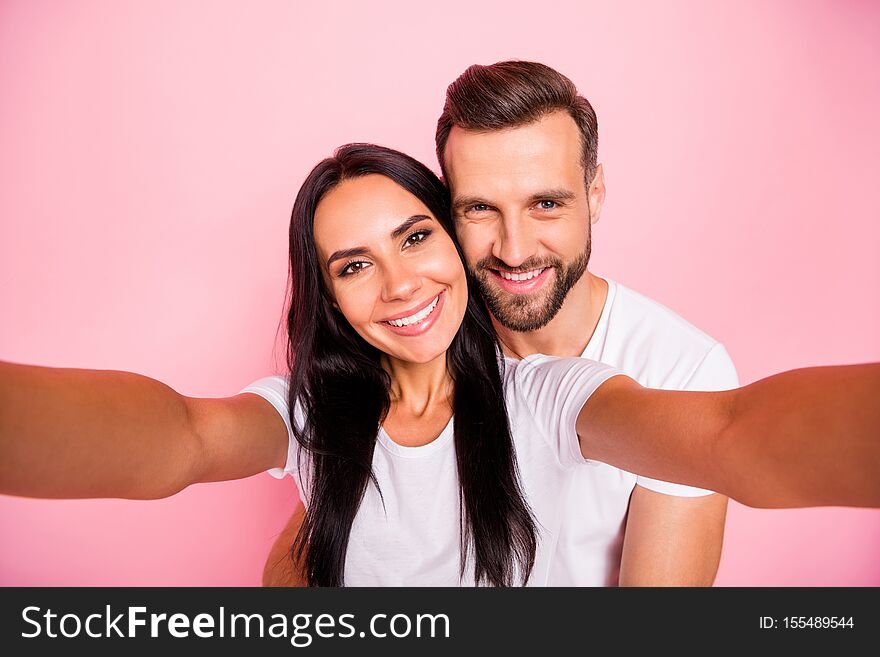 Photo of nice couple with men hugging, his beloved girlfriend from back while isolated with pastel background