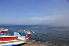 Fishing Boats On Shore On Clear Blue Sky Day Royalty Free Stock Photography Fishing Boats On Shore On Clear Blue Sky Day Royalty Free Stock Photography