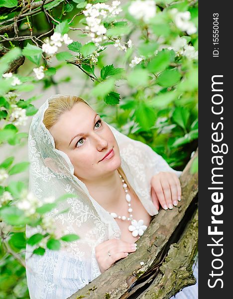 Beautiful bride in blooming garden closeup. Beautiful bride in blooming garden closeup