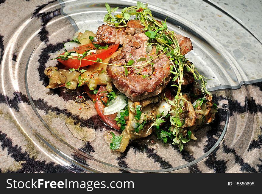 Grilled meat with vegetables served on the table