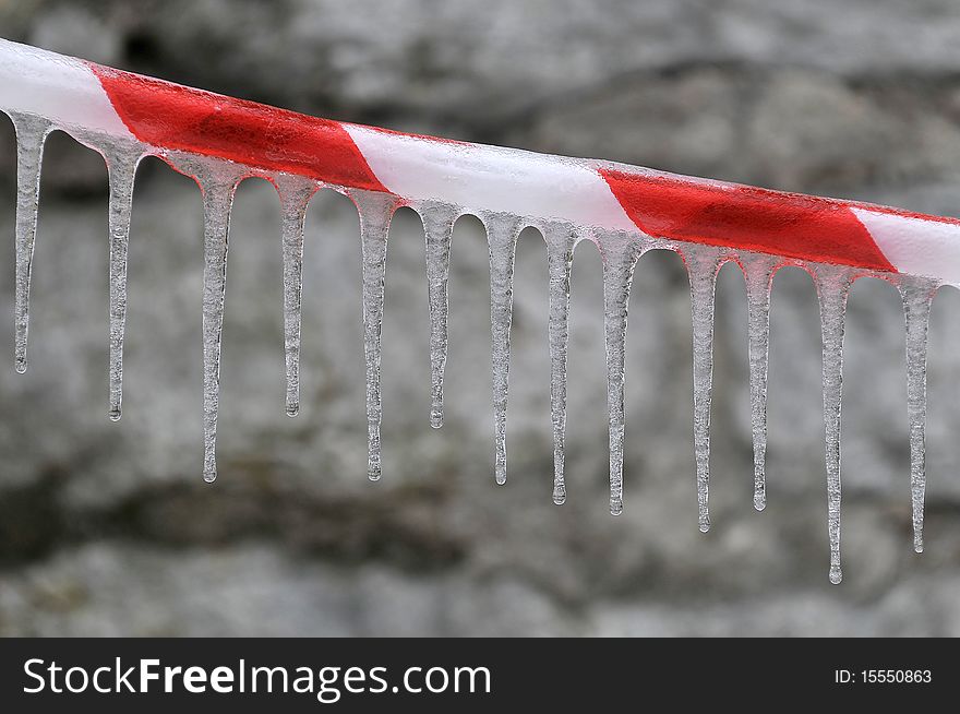 Deserted strip with a icicled on the stone background