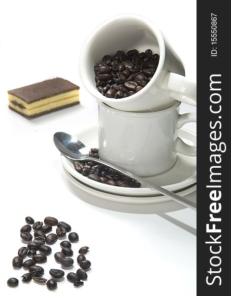 Cup coffee with coffee beans with chocolate cake. Cup coffee with coffee beans with chocolate cake