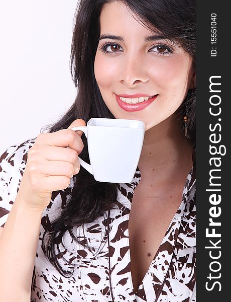 Woman drinking coffee in a white cup