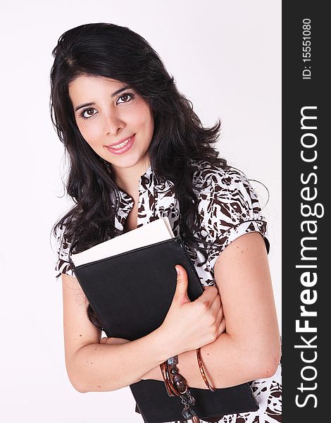 Woman looking at the camera with some books over white background. Woman looking at the camera with some books over white background