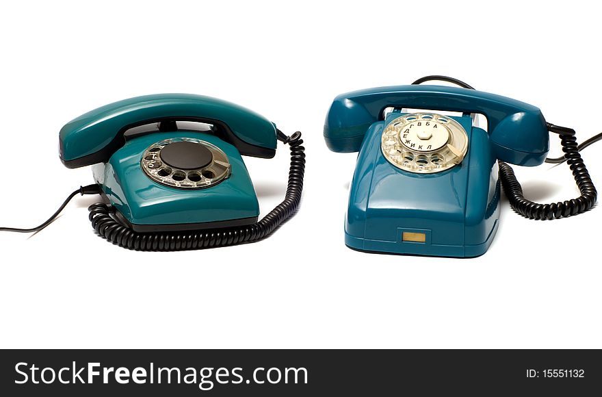 Two old dial phone on a white background. Two old dial phone on a white background.