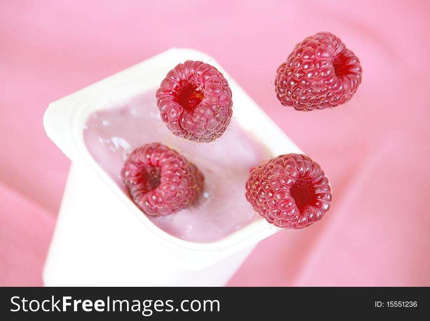 Raspberries Falling Into Yogurt