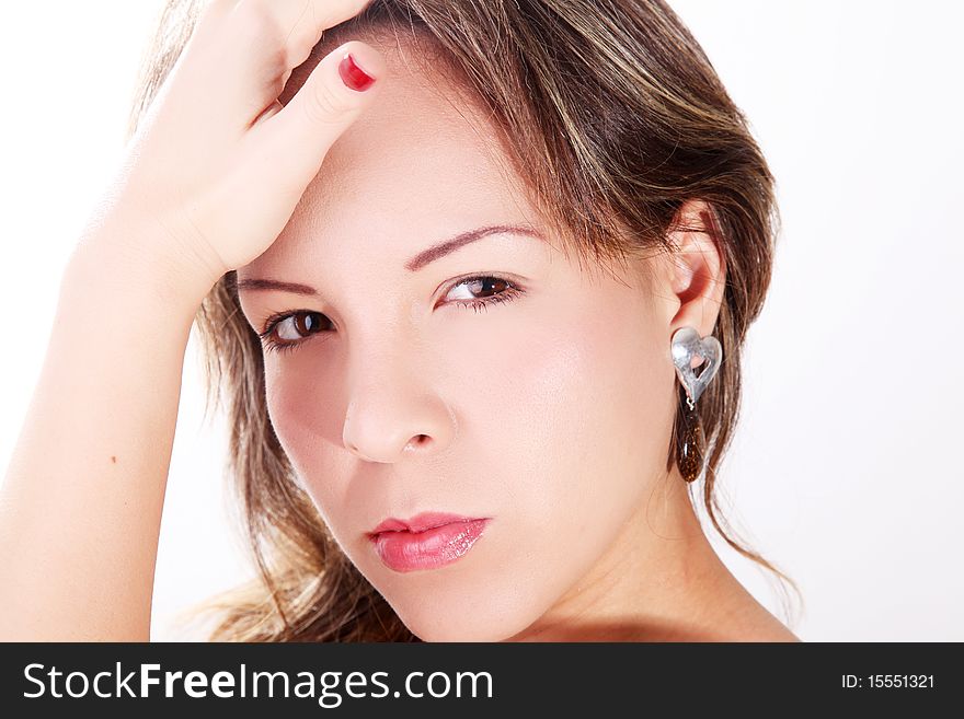 Woman with hands on face looking at the camera