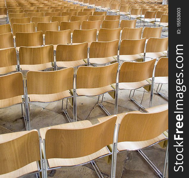 Multiple rows of aligned chairs.