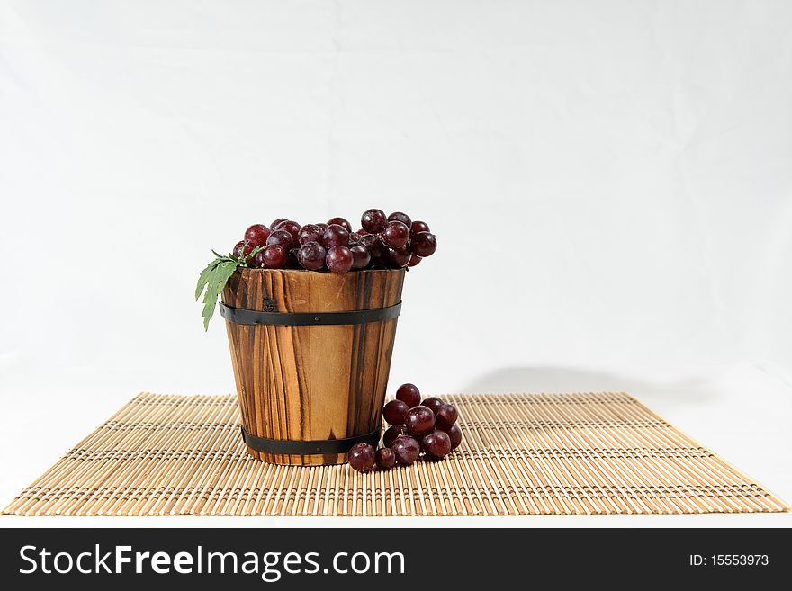 A bunch of grape in wooden basket