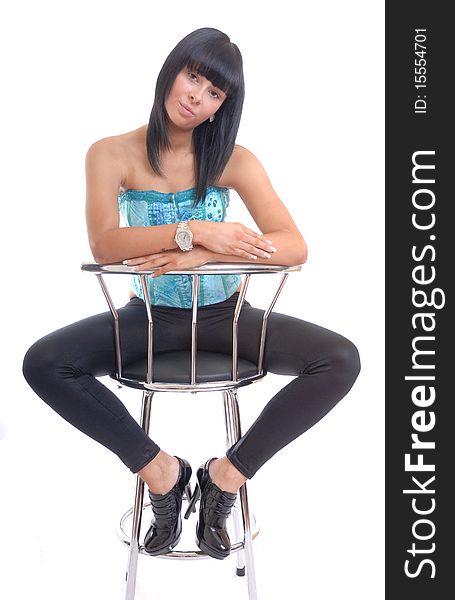 Photograph showing cute young girl sat on stool isolated. Photograph showing cute young girl sat on stool isolated