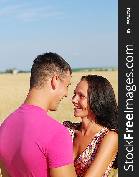 Close-up of  young couple loving in rural wheat field. Close-up of  young couple loving in rural wheat field