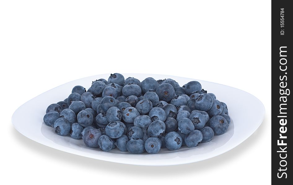Blueberries on the plate isolated on white