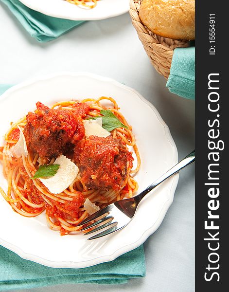 Spaghetti with tomato sauce and large meatballs