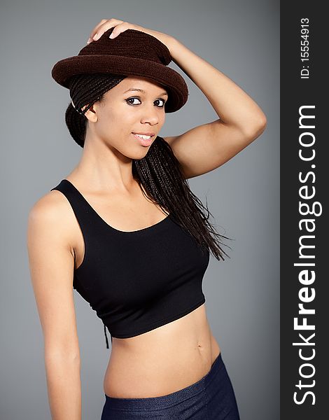 Black and white portrait of a beautiful afro american model wearing a hat. Black and white portrait of a beautiful afro american model wearing a hat