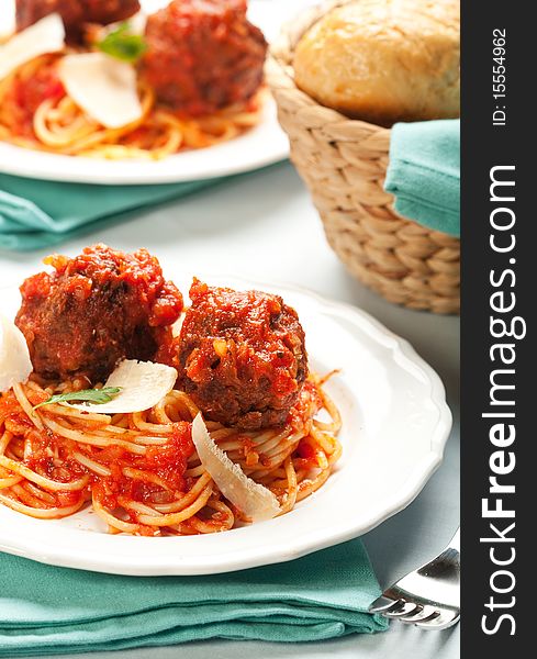 Spaghetti with tomato sauce and large meatballs