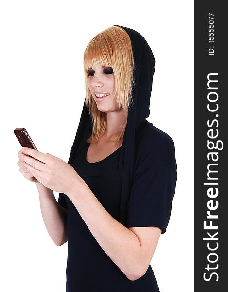 An pretty blond woman with her cell phone is messaging to her friends in the studio, on white background. An pretty blond woman with her cell phone is messaging to her friends in the studio, on white background.