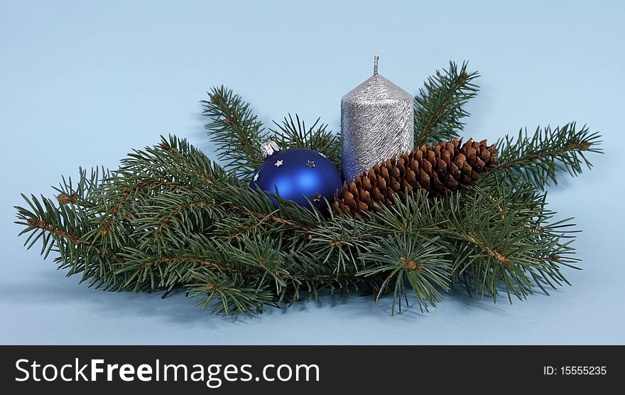 Christmas decoration with the twigs of the spruce and candle