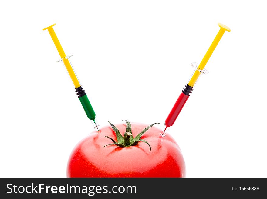 Syringe Injecting Red Green Liquid Into Tomato