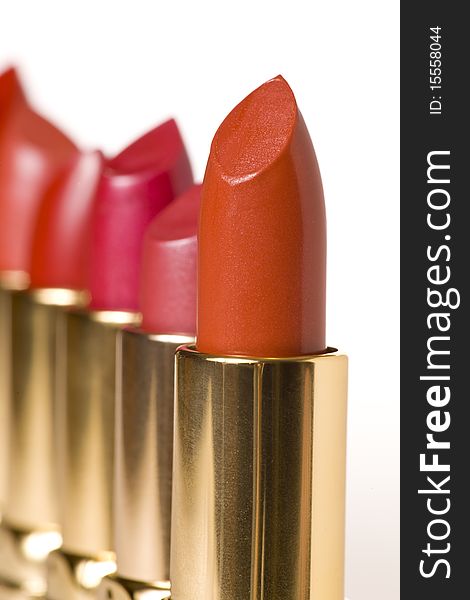 Multicolored Lipsticks photographed on white background