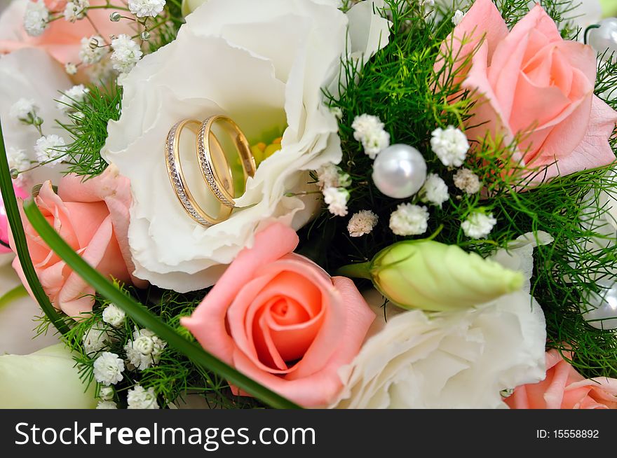 Gold rings on a wedding bouquet. Gold rings on a wedding bouquet