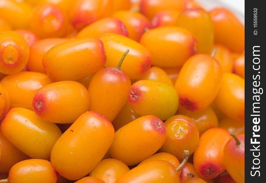 A bucket of sea buckthorn isolated on white