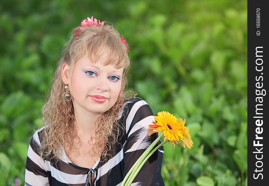 Outdoor portrait of woman with flowers