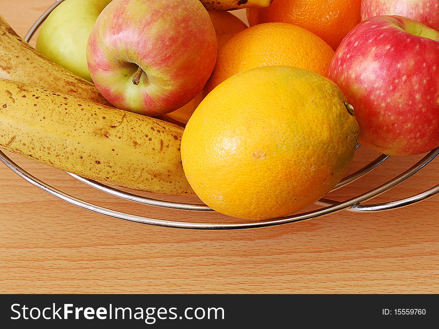Fruit in a wire basket. Fruit in a wire basket