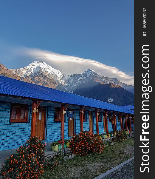 Annapurna Base Camp hiking trek, Himalayas, Nepal. November, 2018. A beautiful guest house in Chomrong with South Annapurna on the