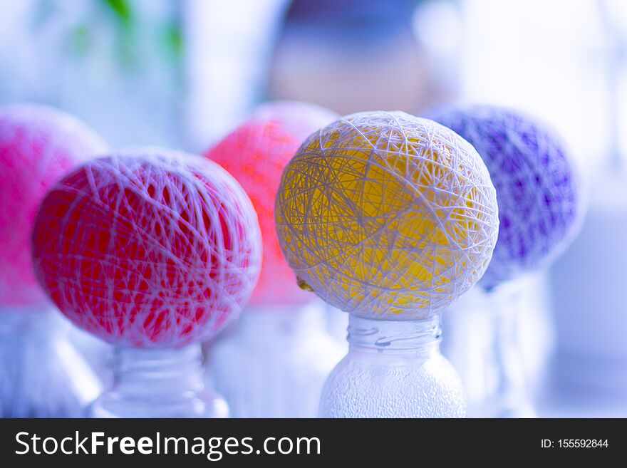 Multicolor balloons drying to become yarn decorative balls. Multicolor balloons drying to become yarn decorative balls