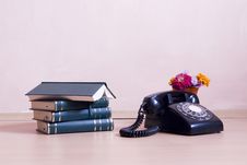 Stack Of Books With Vintage Telephone And Flowers Stock Images