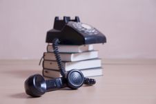Stack Of Books With Vintage Telephone On Top Royalty Free Stock Photos