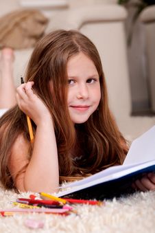 Closeup Of Cute Little Girl Doing Her Homework Royalty Free Stock Photography