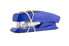 Blue Stapler Wrapped With Rubber Band Royalty Free Stock Images