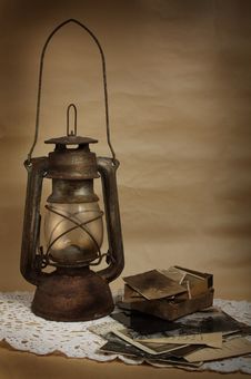 Old Kerosene Lamp And Photos Royalty Free Stock Photography Old Kerosene Lamp And Photos Royalty Free Stock Photography