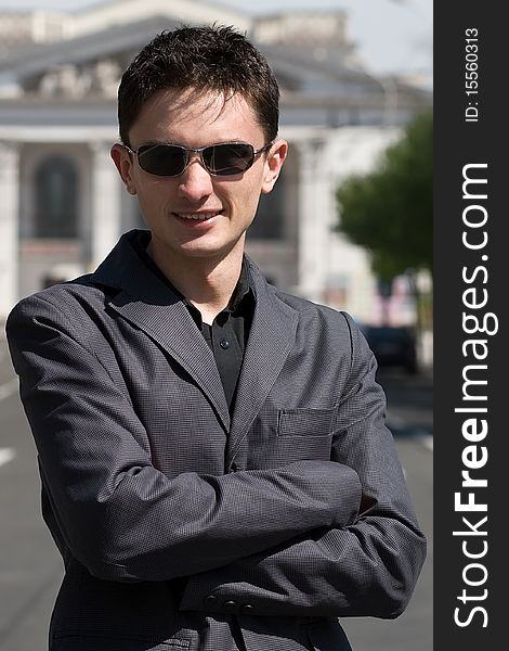 Young adult european man in black sunglasses