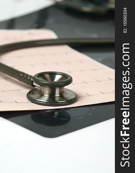 Doctor's stethoscope and chart a patient's heart. Doctor's stethoscope and chart a patient's heart