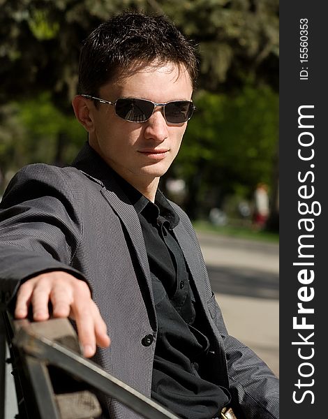 Young Businessman Sitting On A Bench