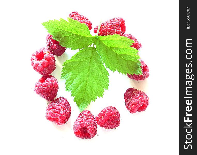 Berries of raspberry and leave on a white background