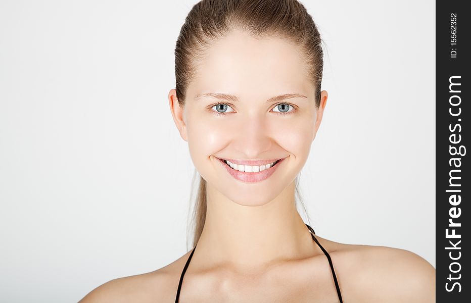 Attractive smiling woman portrait on white background