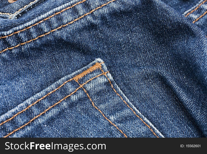 Pocket detail of blue denim jeans