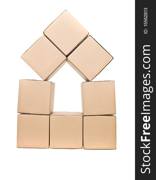 Cardboard boxes formed as a house isolated on white background