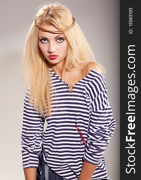 Beautiful blond woman in sailor shirt with collar on her nead. Beautiful blond woman in sailor shirt with collar on her nead