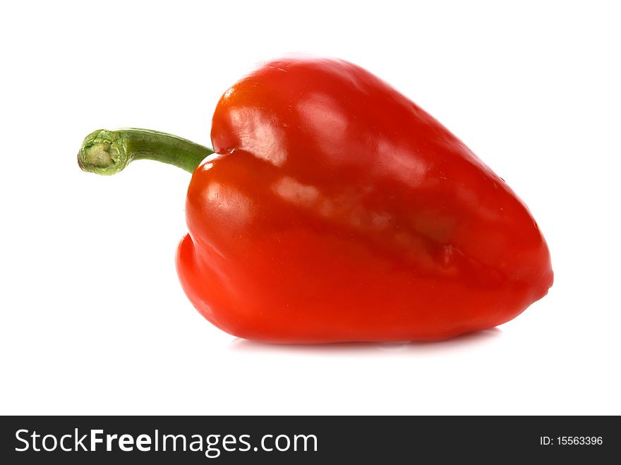 Red pepper and green leaf isolated on white background