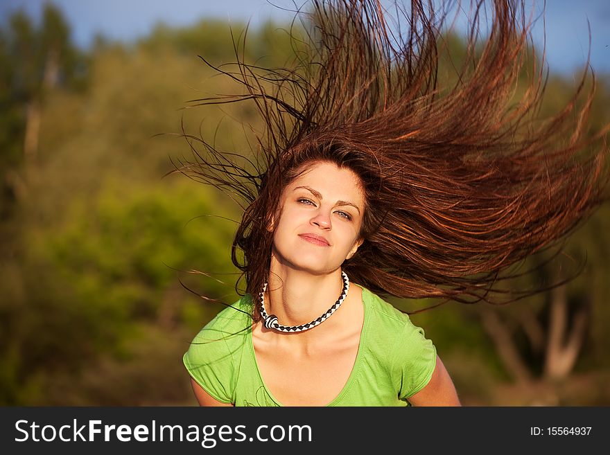 Young woman with hair flying outdoor